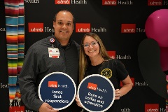 UTMB employee Richard Arocho, posing with PHI representative at recent EMS Lecture Series event