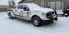 white and yellow EMS truck parked in snow. text on vehicle says "La Porte EMS" and "Supervisor"