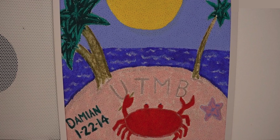 image of painted ceiling tile that features a crab and a star fish on a beach facing the sun, surrounded by water. Palm trees are also included as are the words "UTMB" and "DAMIAN 1-22-14"