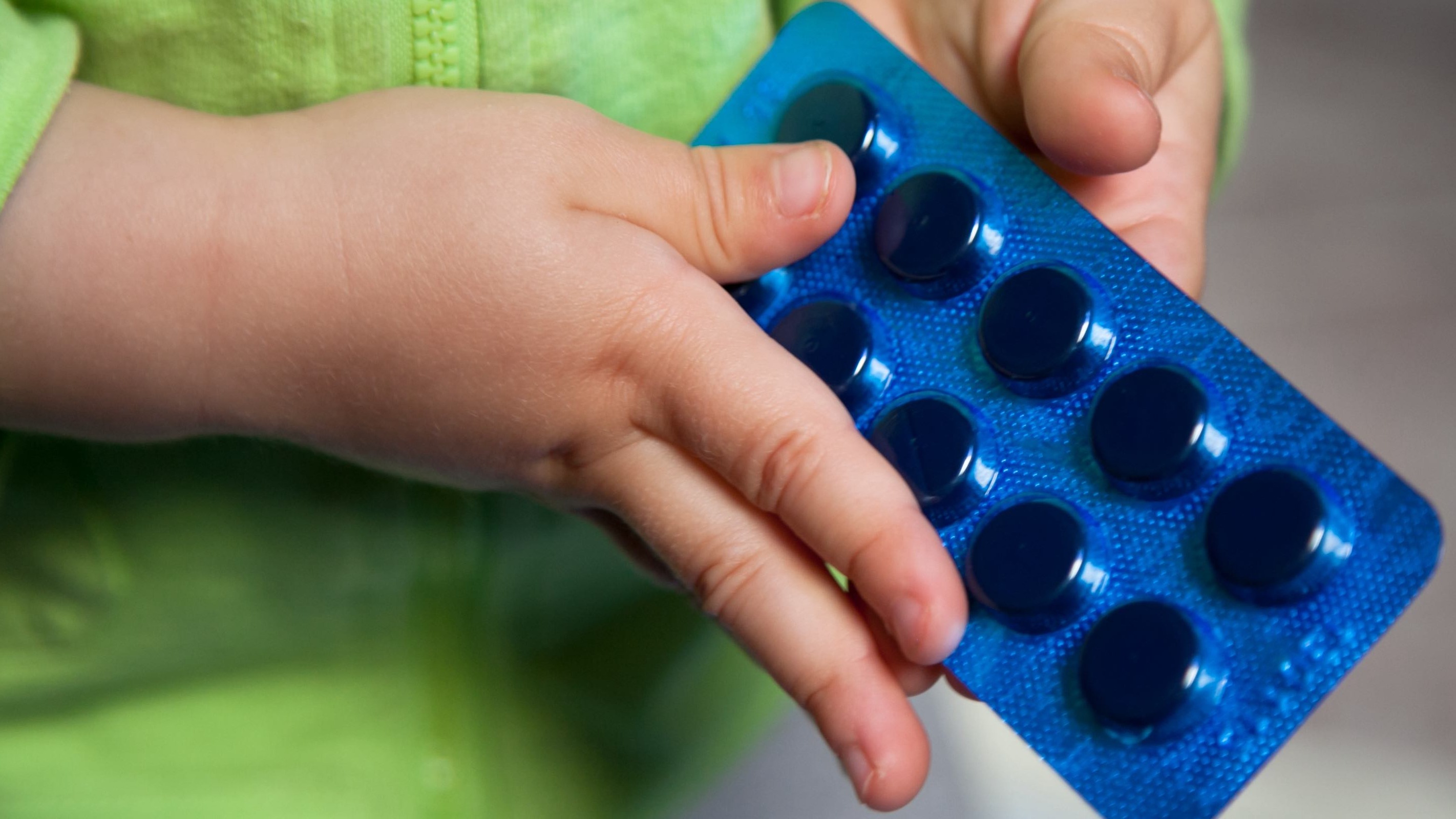 child holding medicine