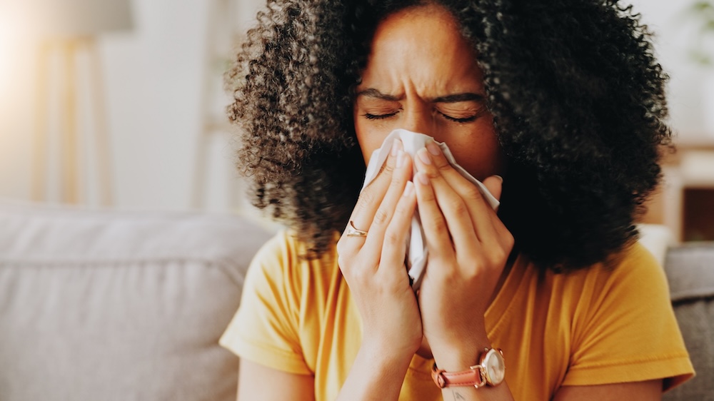 Women with tissue sneezing