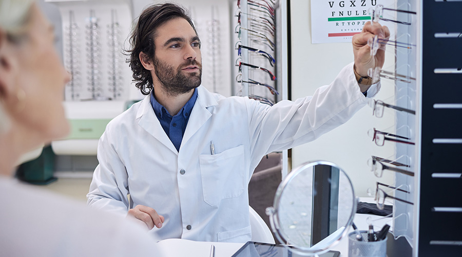 Eye doctor, glasses or woman consulting for eyesight advice at optometrist or ophthalmologist with medical aid.