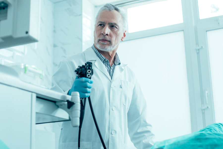 UTMB Health doctor performing endoscopy in his clinic