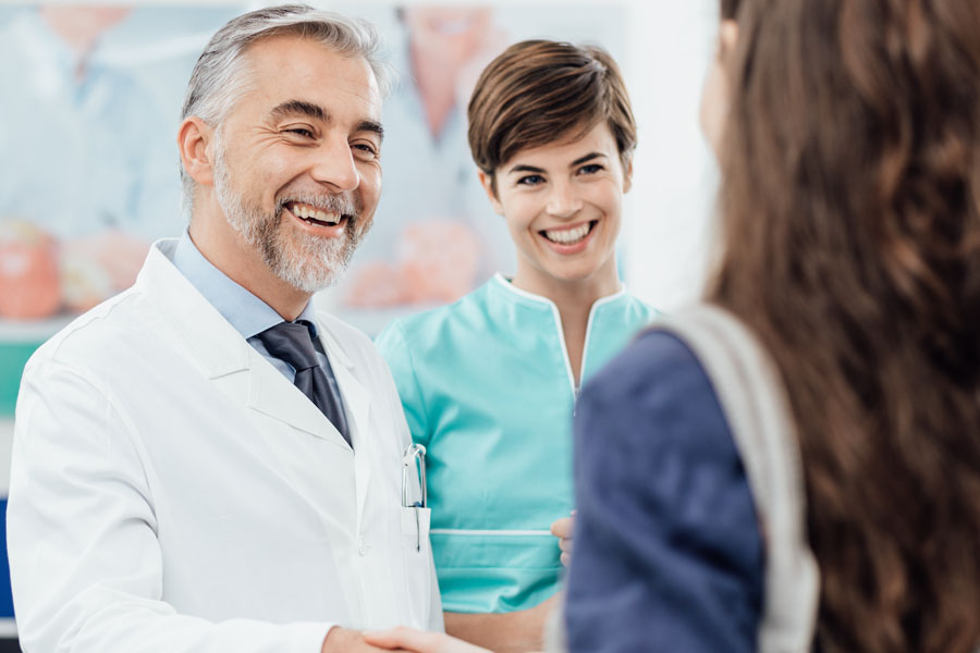 Doctor welcoming a patient at the clinic