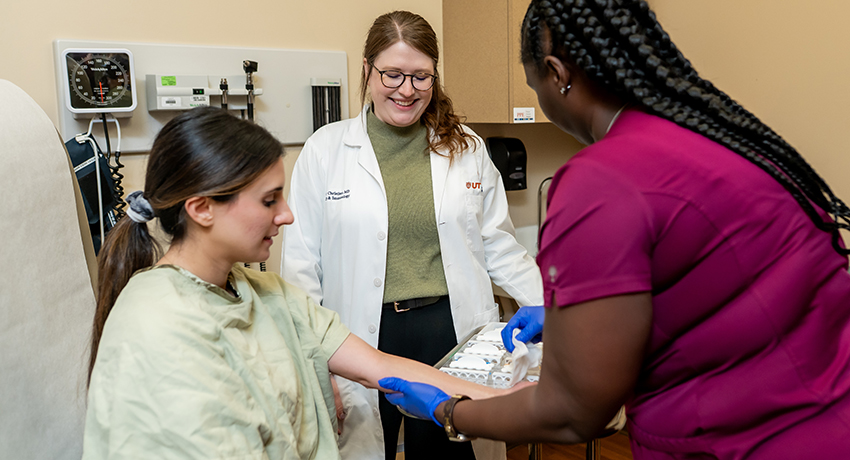 Medical staff administering an allergy skin test.
