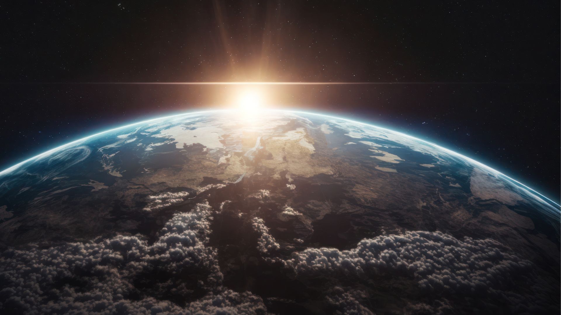 The sun rising over planet earth as seen from space