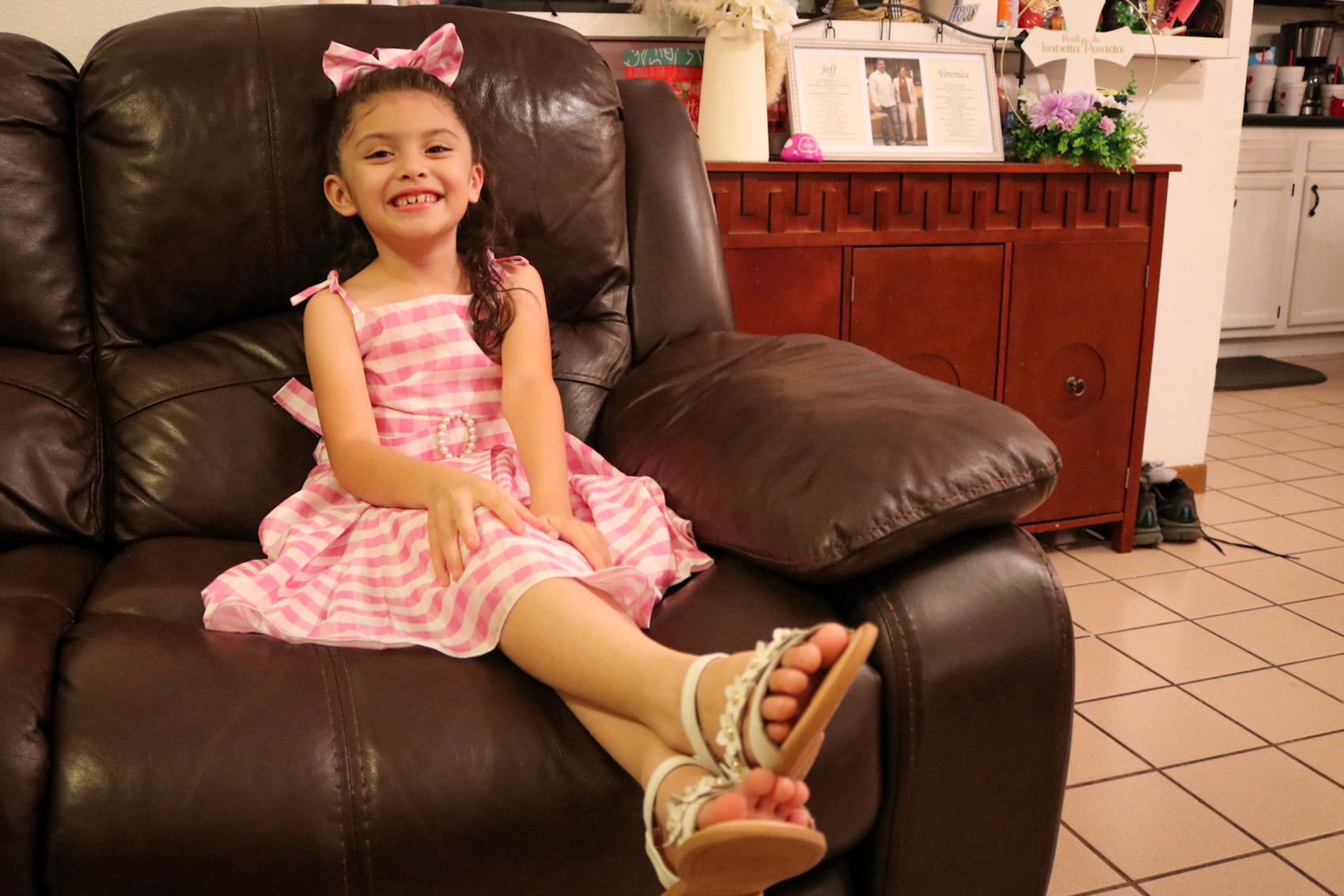 Aliah Martinez sits on brown lazy chair