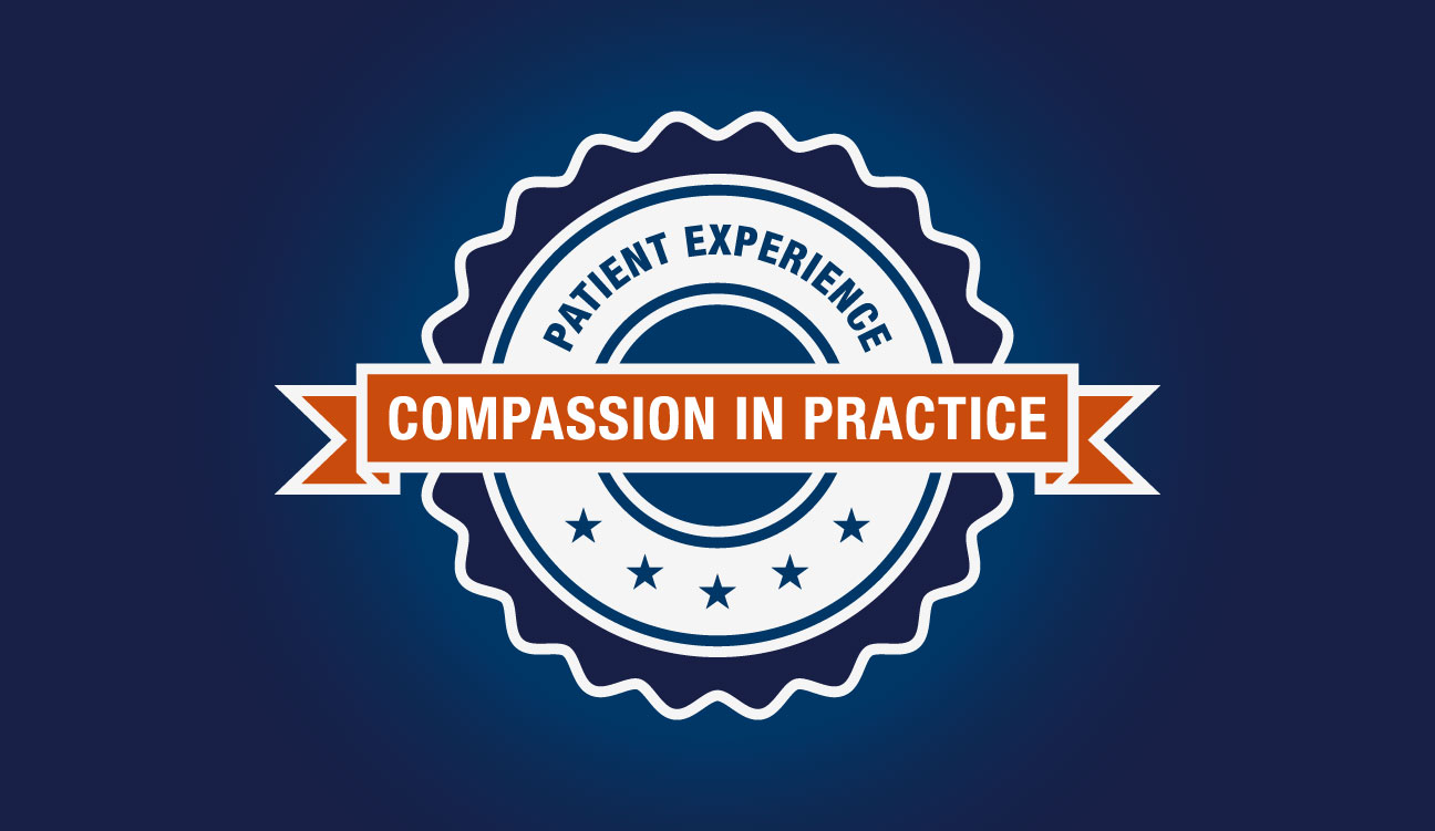 A circular badge-style graphic with the words “Patient Experience” around the top and a ribbon across the center reading “Compassion in Practice,” set against a dark blue background.