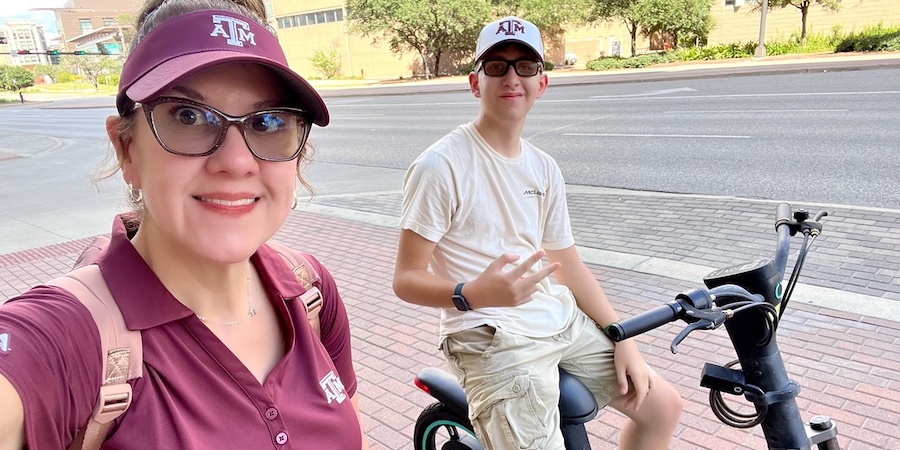 UTMB patient Felicity Cunningham riding an electric bicycle next to her teenage son