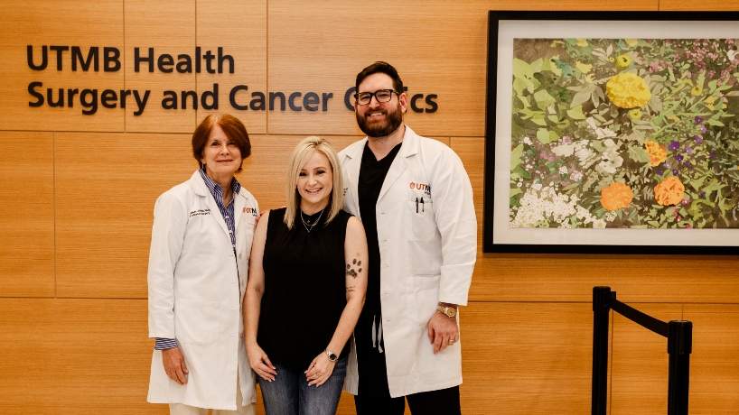 Rachel Compton stands between her doctors, Colleen Silva, MD, and Jeffrey Smith, MD, inside UTMB Health Surgery and Cancer Clinics.