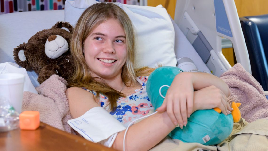 Starlight dontation 4 A patient at UTMB John Sealy Hospital hugs a stuffed toy donated by Tantrum Merch and Starlight Children's Foundation