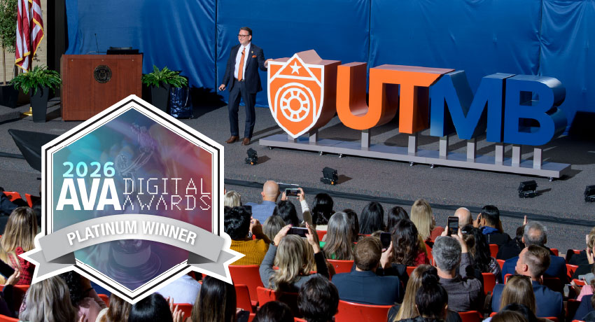 A speaker stands onstage beside large UTMB letters while an audience looks on, with a 2026 AVA Digital Awards Platinum Winner badge displayed in the foreground.