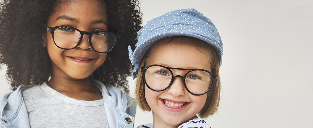 two children wearing glasses