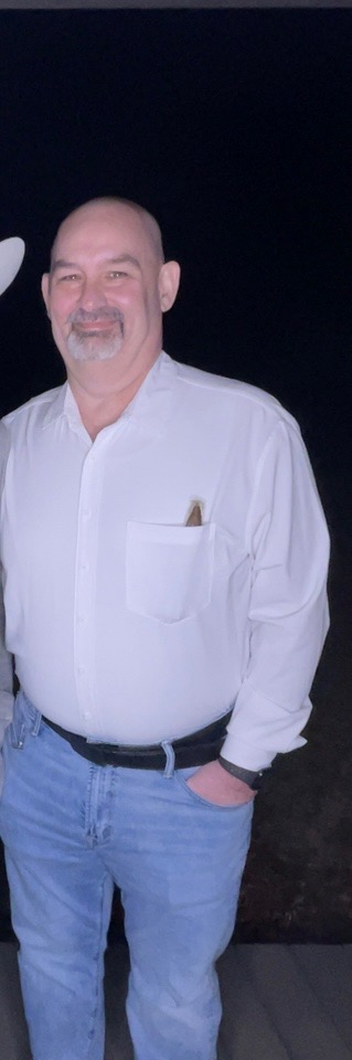 man standing with hand in pocket